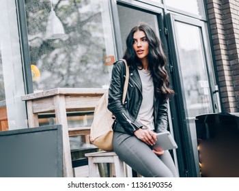 Young Pretty Spanish Woman In Cafe In City Centre