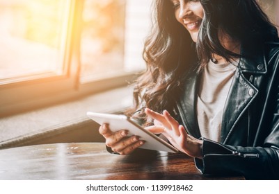 Young Pretty Spanish Woman In Cafe In City Centre With Tablet Laptop