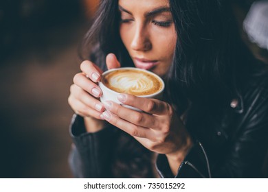 Young Pretty Spanish Woman In Cafe In City Centre With Tablet Laptop