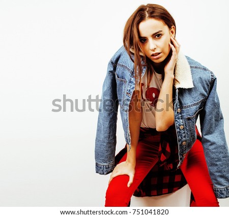 young pretty teenage hipster girl posing emotional happy smiling on white background, lifestyle people concept 