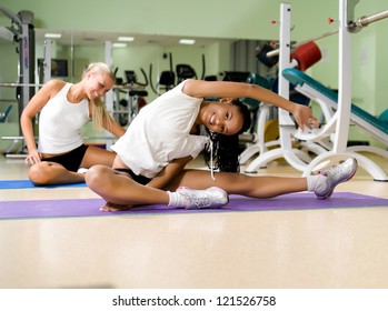 Young pretty woman doing exercises at the fitness club - Shutterstock ID 121526758