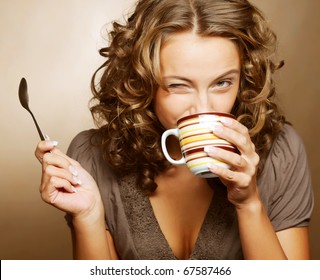 Young Pretty Woman Drinking Coffee