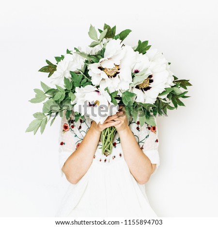 Similar – Image, Stock Photo Hand holding white peony,  minimalist grey background