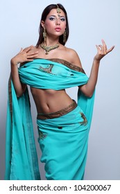 young pretty woman in indian turquoise sari