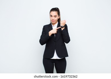 Young Pretty Woman Looking Impatient And Angry, Pointing At Watch, Asking For Punctuality, Wants To Be On Time Business Concept