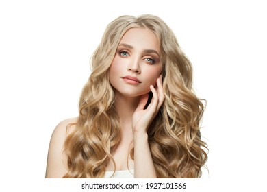 Young pretty woman model with long healthy curly blonde hair and clear skin isolated on white background