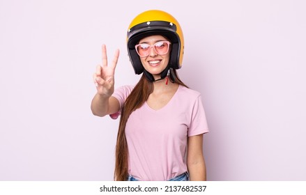 Young Pretty Woman With A Motorbike Helmet.