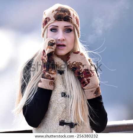 young pretty woman portrait outdoor in winter
