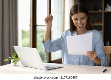 Young pretty woman sit desk reading letter, feels happy received good news, celebrate great opportunity. Bank mortgage approval, university admission, career promotion and advancement, success concept - Shutterstock ID 2179190487