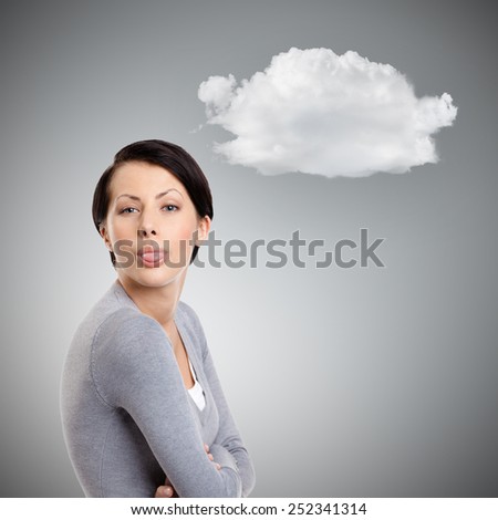 Young pretty woman sticks out tongue,  grey background