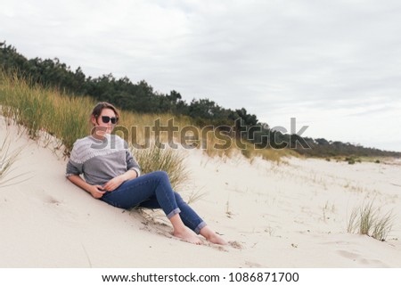 Similar – Young woman and Labrador at the Baltic Sea beach