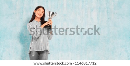young pretty woman with a trophy