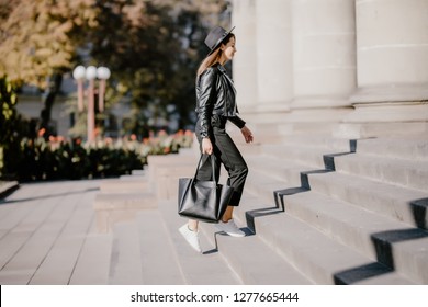 Young pretty woman walking up the stairs in the city - Powered by Shutterstock