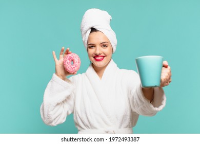 young pretty woman wearing bathrobe happy expression and having a breakfast
