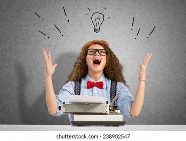 Young pretty woman writer with typing machine - Shutterstock ID 238902547