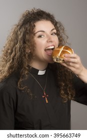 Young Priest Eating Hot Cross Buns A Tradition At Easter Time