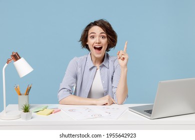 Young Proactive Smart Successful Employee Business Woman 20s In Casual Shirt Sit Work At White Office Desk With Pc Laptop Holding Index Finger Up With Great New Idea Isolated On Blue Background Studio