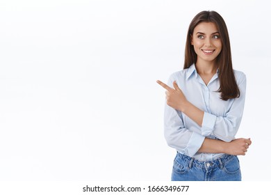 Young Professional And Confident Lady Boss Searching How Improve Her Company Visit Business Lectures Pointing Finger Left And Look Curious With Happy Pleased Smile, Stand White Background