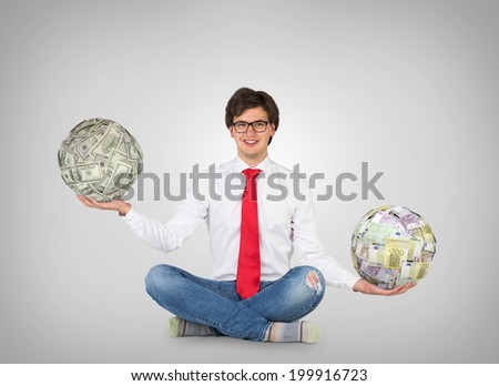 A young professional evaluates differences between dollar and euro currencies.