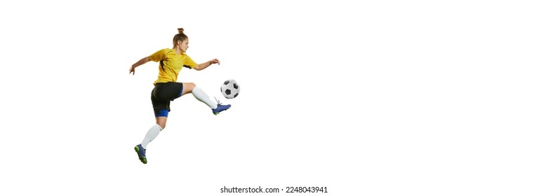 Young professional female football player in motion, training, playing football, soccer isolated over white background. Banner, flyer. Concept of sport, action, motion, goals, competition, hobby - Powered by Shutterstock