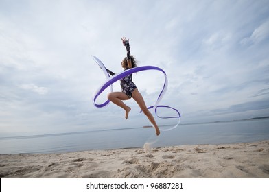 Young Professional Gymnast Woman Dance With Ribbon - Outdoor Sand Beach