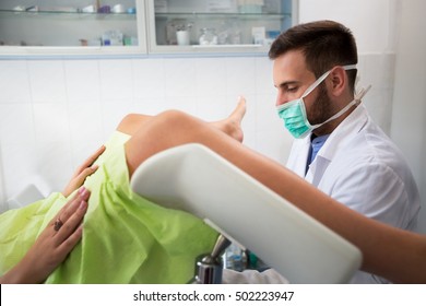 Young Professional Gynecologist Exam His Patient At Clinic