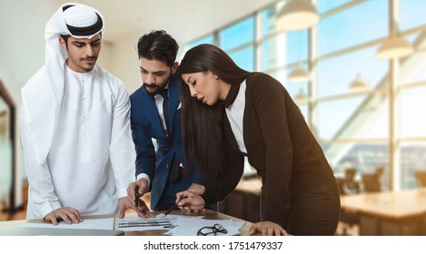 Young professional team. Group of Arabic modern people in smart casual wear having a brainstorm meeting while standing in the creative office