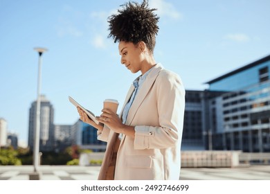 Young Professional Woman Working on Tablet in Urban Business Environment - Powered by Shutterstock