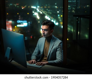 Young Professional Write Report at Night Office - Shutterstock ID 1904057284