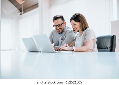 Young Professionals In Front Of A Computer