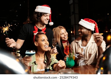 Young professionals gather joyfully, celebrating the holiday spirit with drinks and laughter. - Powered by Shutterstock