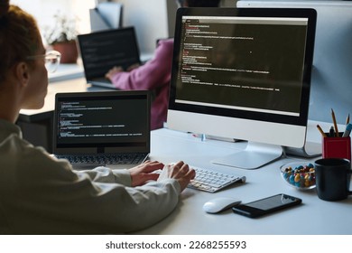 Young programmer typing security code