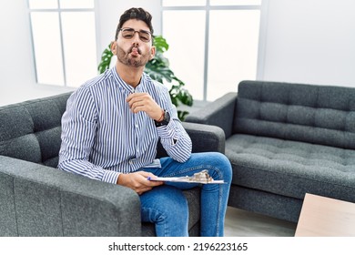 Young Psychologist Man At Consultation Office Making Fish Face With Lips, Crazy And Comical Gesture. Funny Expression. 