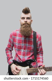 Young Punk Rocker Man Playing Electric Guitar. Excited Men Portrait Isolated On Gray Background.