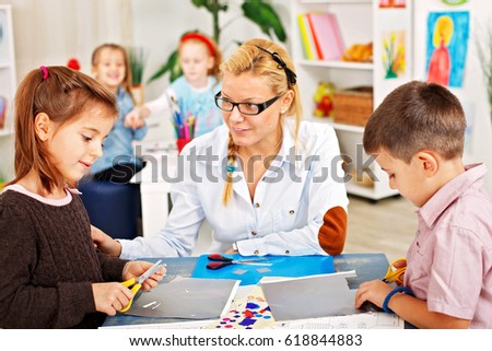 Young pupils doing creative work on a class .
