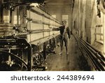 Young Raoul Julien had already worked for two years in the mule-spinning room in Chace Cotton Mill, Burlington, Vermont, when Lewis Hine took this photo in 1909.