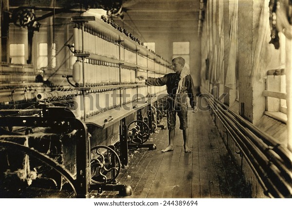 Young Raoul Julien had already\
worked for two years in the mule-spinning room in Chace Cotton\
Mill, Burlington, Vermont, when Lewis Hine took this photo in\
1909.