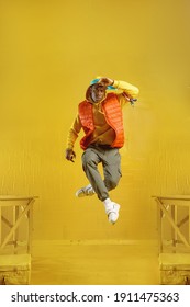 Young rapper jumps in studio with yellow tones