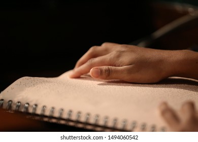 A Young Reading Braille Bible