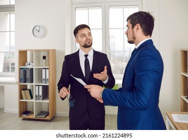 Young Real Estate Agent, Mortgage Broker, Or Business Advisor In Suit Meeting New Client In His Office, Talking About Contract Agreement, Giving Thorough Consultation, Explaining Terms And Conditions