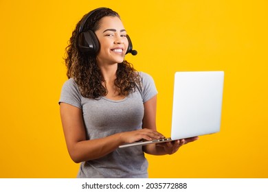 young receptionist woman working with notebook and headset.
