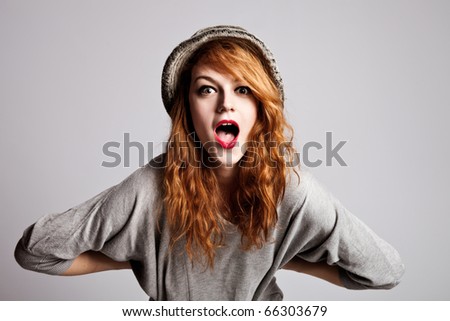 Similar – Young happy woman sticking out her tongue