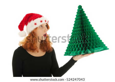 Young red haired woman with paper Christmas tree