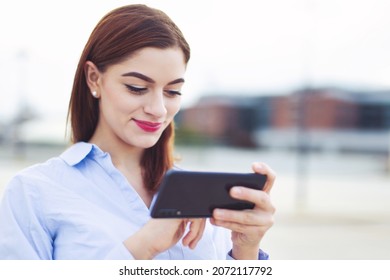 Young Redhead Caucasian White Collar Worker Messaging On Mobile Phone Outdoors