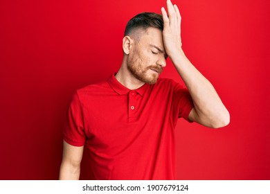 Young Redhead Man Wearing Casual Clothes Surprised With Hand On Head For Mistake, Remember Error. Forgot, Bad Memory Concept. 