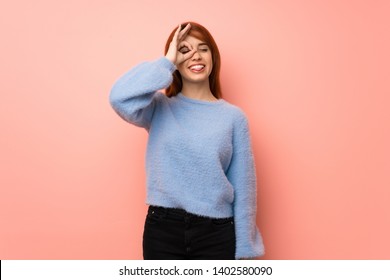 Young redhead woman over pink background makes funny and crazy face emotion - Shutterstock ID 1402580090