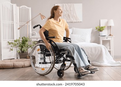 Young redhead woman sitting in wheelchair at home - Powered by Shutterstock