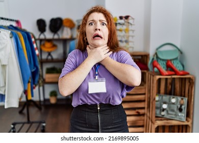 Young redhead woman working as manager at retail boutique shouting and suffocate because painful strangle. health problem. asphyxiate and suicide concept. 