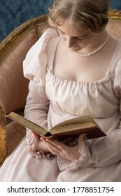 A Young Regency Woman In A Pink Dress In A Regency Room