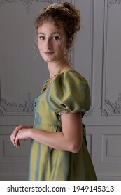 A Young Regency Woman Wearing A Silk Dress Shown In Half View